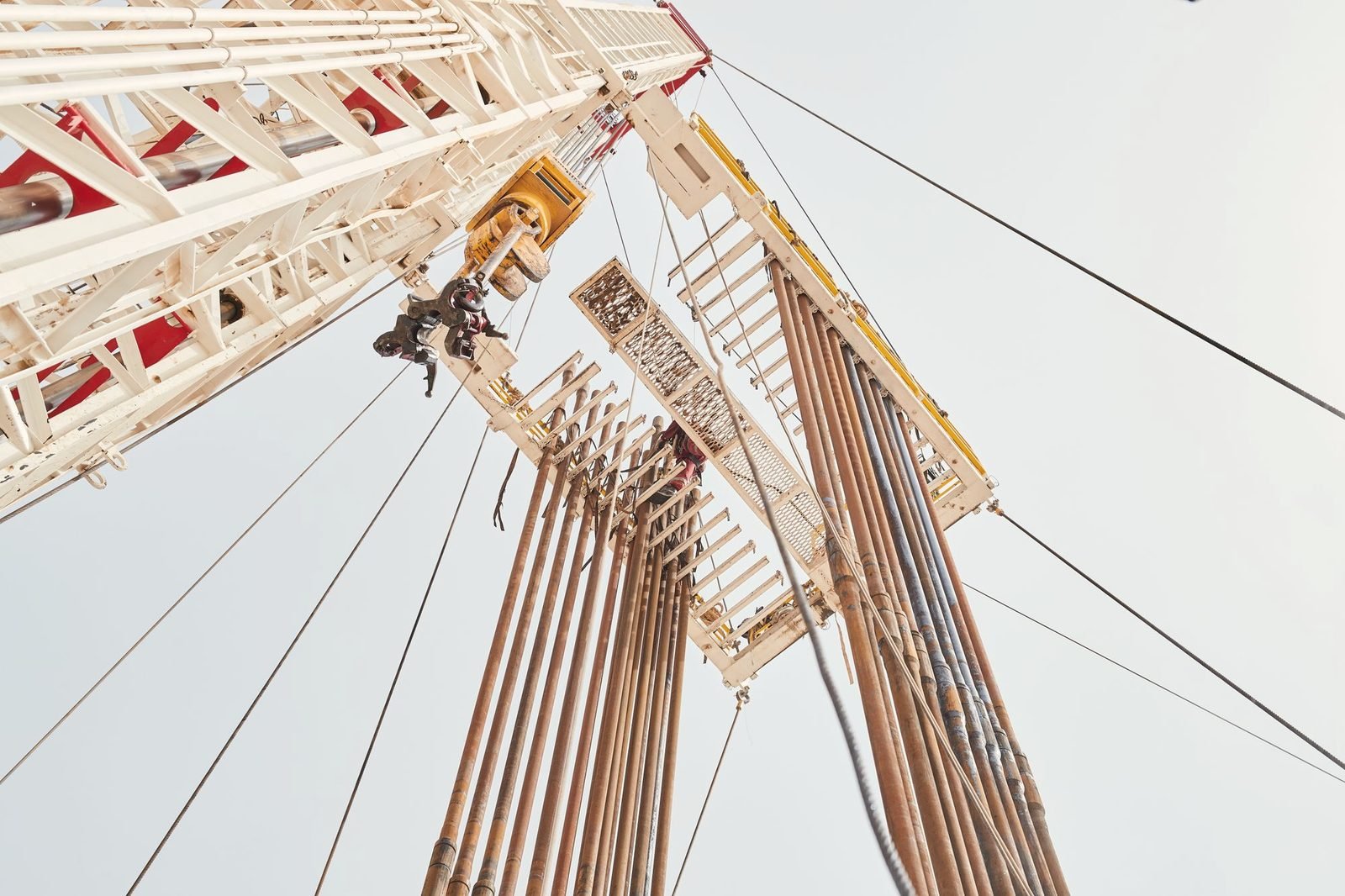 Looking up a derrick at stands of drill pipe racked in the fingerboard